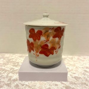 White porcelain tea cup w/lid